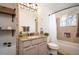 Bathroom featuring decorative tile, granite countertop, and modern fixtures at 1492 S Dudley St, Lakewood, CO 80232