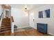 Foyer has a hardwood floor, entry closet, and stairs to the second floor at 1492 S Dudley St, Lakewood, CO 80232