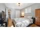 Comfortable main bedroom with hardwood floors, closet, and ensuite bathroom at 1492 S Dudley St, Lakewood, CO 80232