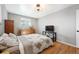 Charming bedroom with a ceiling fan, dresser, and a well-lit ambiance at 1492 S Dudley St, Lakewood, CO 80232