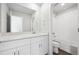 Bathroom featuring a white vanity with modern fixtures, a large mirror, and a bathtub/shower combination at 2145 Flower Blossom Ave, Brighton, CO 80601