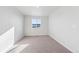 Bedroom features carpet flooring, a large window that brings in natural light, and ample space at 2145 Flower Blossom Ave, Brighton, CO 80601