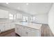 Spacious and well-lit kitchen with an island, sleek countertops and ample cabinet space at 2145 Flower Blossom Ave, Brighton, CO 80601