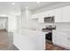 Bright kitchen with stainless steel appliances, ample cabinet space, an island and sleek countertops at 2145 Flower Blossom Ave, Brighton, CO 80601