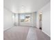 Spacious main bedroom with carpeting, natural light and an ensuite bathroom at 2145 Flower Blossom Ave, Brighton, CO 80601