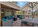Inviting covered deck with ample seating, dining area, grill, and a relaxing ambiance for outdoor living at 11302 E Ida Ct, Englewood, CO 80111