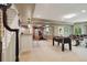 Finished basement area featuring a bar, workout area, foosball table, and drum set for entertainment at 11302 E Ida Ct, Englewood, CO 80111