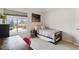 Cozy bedroom with a twin bed, large window with neighborhood view and a desk for work or study at 11302 E Ida Ct, Englewood, CO 80111