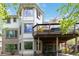 Multi-level deck showcasing covered and uncovered areas, providing various outdoor living spaces at 11302 E Ida Ct, Englewood, CO 80111