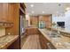 Large kitchen with granite counters, stainless appliances, and ample storage at 11302 E Ida Ct, Englewood, CO 80111