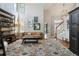 Bright living room with high ceilings, large windows, and modern decor at 11302 E Ida Ct, Englewood, CO 80111