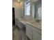 Main bathroom with double vanity and marble flooring at 5124 N Quemoy St, Aurora, CO 80019
