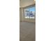Bright bedroom with carpet flooring and large window at 5124 N Quemoy St, Aurora, CO 80019