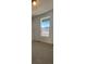 Bright bedroom with carpet flooring and large window at 5124 N Quemoy St, Aurora, CO 80019