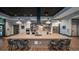Modern community kitchen with stainless steel appliances and bar seating at 5124 N Quemoy St, Aurora, CO 80019