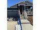 Two-story Craftsman style home with stone accents and a two-car garage at 5124 N Quemoy St, Aurora, CO 80019