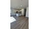 Modern kitchen with stainless steel appliances and an island at 5124 N Quemoy St, Aurora, CO 80019