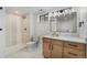 Bathroom features modern vanity, walk-in shower, and stylish fixtures at 8188 S Yukon St, Littleton, CO 80128