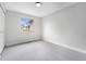 Bright bedroom with gray carpet, a window, fresh paint, and ample natural light at 8188 S Yukon St, Littleton, CO 80128