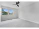 Bedroom with neutral carpet, gray walls, and ceiling fan at 8188 S Yukon St, Littleton, CO 80128