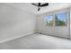 Bedroom with plush carpeting, two windows, and plenty of natural light at 8188 S Yukon St, Littleton, CO 80128