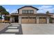 Charming home featuring a three-car garage, elegant tile roofing, and meticulous landscaping at 8188 S Yukon St, Littleton, CO 80128