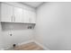 Utility room with washer and dryer hookups and ample storage cabinets at 8188 S Yukon St, Littleton, CO 80128