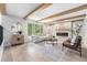 Inviting living room with a fireplace, wood beams, and stylish contemporary furnishings at 8188 S Yukon St, Littleton, CO 80128