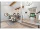 Open living area with hardwood floors, stylish seating, and a view into the dining area at 8188 S Yukon St, Littleton, CO 80128