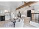 Loft area with a wet bar, sitting area, bedroom and a barn door to the bathroom at 8188 S Yukon St, Littleton, CO 80128