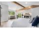 Vaulted main bedroom with wooden beams, fireplace, private balcony and plenty of natural light at 8188 S Yukon St, Littleton, CO 80128