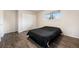 Comfortable bedroom with hardwood floors, a window, and a closet at 12662 W Virginia Ave, Lakewood, CO 80228