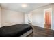 Cozy bedroom with hardwood floors, a neutral color scheme, and ample natural light at 12662 W Virginia Ave, Lakewood, CO 80228