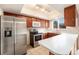 Well-lit kitchen featuring stainless steel appliances and a practical layout at 12662 W Virginia Ave, Lakewood, CO 80228
