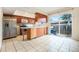 Bright eat-in kitchen with modern stainless steel appliances and access to the backyard at 12662 W Virginia Ave, Lakewood, CO 80228