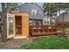 The backyard features a wooden deck and wooden sauna structure. Perfect for outdoor entertaining and relaxation at 8508 Vivian Ct, Arvada, CO 80005