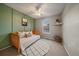 Charming bedroom featuring board and batten, natural light, and a cozy, inviting atmosphere at 8508 Vivian Ct, Arvada, CO 80005