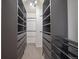 Spacious walk-in closet with custom shelving and ample storage, providing organization and convenience at 8508 Vivian Ct, Arvada, CO 80005