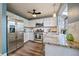 Modern kitchen featuring stainless steel appliances, granite countertops, and a window overlooking the backyard at 8508 Vivian Ct, Arvada, CO 80005