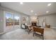 Bright living room boasts a cozy fireplace and sliding door access to the spacious outdoor deck at 8508 Vivian Ct, Arvada, CO 80005