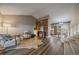 Open-concept living room flows to the dining area and features a decorative wood wall at 8508 Vivian Ct, Arvada, CO 80005