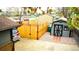 Cozy backyard with wooden fence, storage shed, and concrete driveway; perfect for outdoor activities at 1528 Coronado Pkwy, Denver, CO 80229
