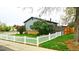 Backyard view showing fenced yard and large trees at 1528 Coronado Pkwy, Denver, CO 80229