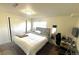 Comfortable bedroom with a large bed, closet, and a functional workspace at 1528 Coronado Pkwy, Denver, CO 80229