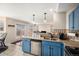 Modern kitchen featuring stainless steel appliances, stone countertops, and tiled backsplash at 11613 W Coal Mine Dr, Littleton, CO 80127