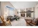 Charming living room with stone fireplace and a vaulted ceiling at 11613 W Coal Mine Dr, Littleton, CO 80127