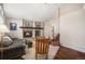 Inviting living room boasts a stone fireplace and ample natural light at 11613 W Coal Mine Dr, Littleton, CO 80127