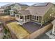 Aerial view of home showcasing the well-maintained yard, covered patio, and solar panels on the roof at 14881 Chicago St, Parker, CO 80134