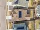 Aerial view of neighborhood showcasing roof with solar panels and backyard with patio at 14881 Chicago St, Parker, CO 80134