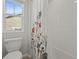 Bright bathroom with floral shower curtain and window at 14881 Chicago St, Parker, CO 80134